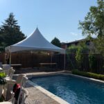 10x20 high peak marquee tent by the pool