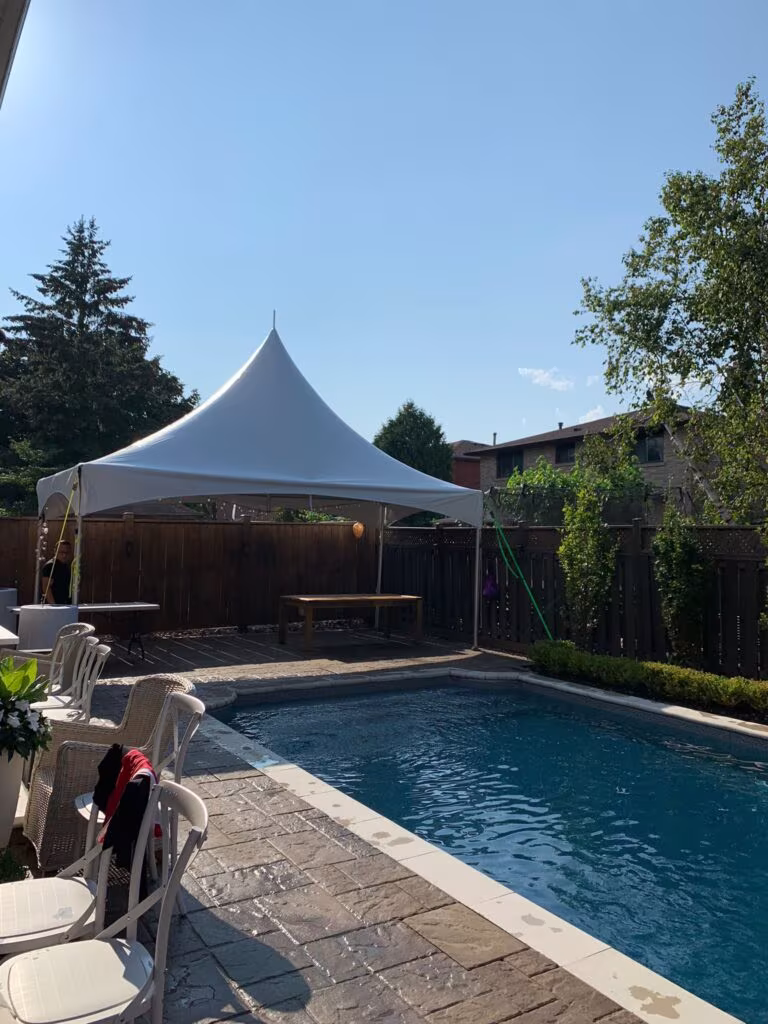 10x20 high peak marquee tent by the pool