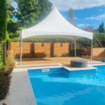 10x20 high peak marquee tent by the pool side