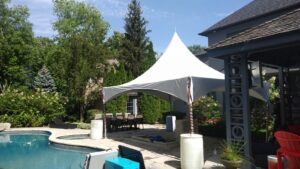 15x20 high peak marquee tent by poolside