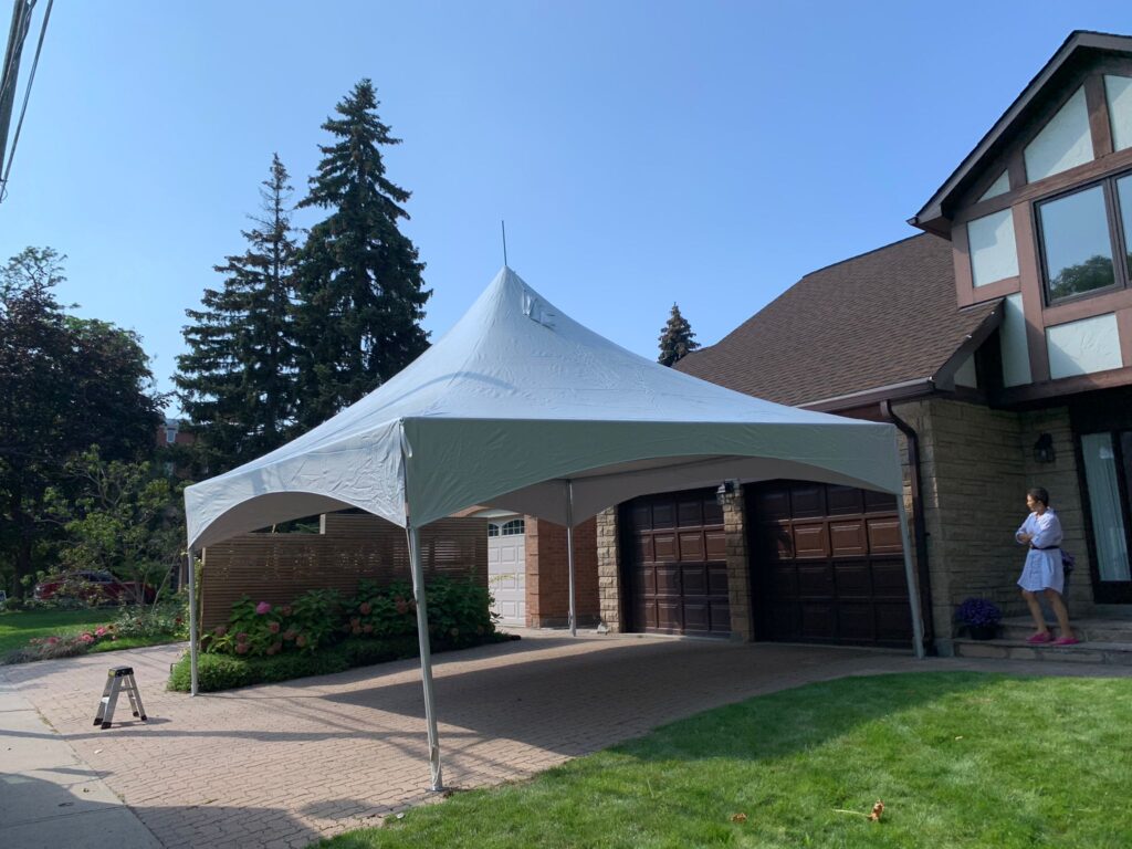 20x20 high peak marquee tent on a driveway