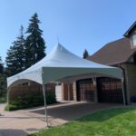 20x20 high peak marquee tent on a driveway