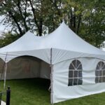 20x30 high peak marquee tent with french window walls on grass