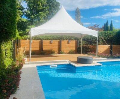 10x20 high peak marquee tent by the pool side