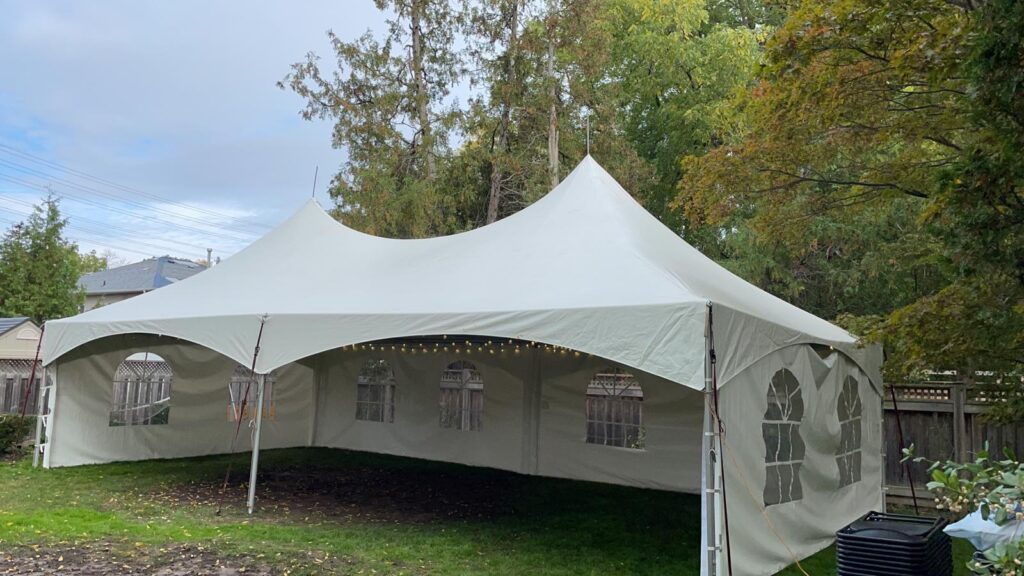 20x40 high peak marquee tent with french window walls and globe lights 1