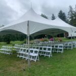 20x40 high peak marquee tent with white resin chairs