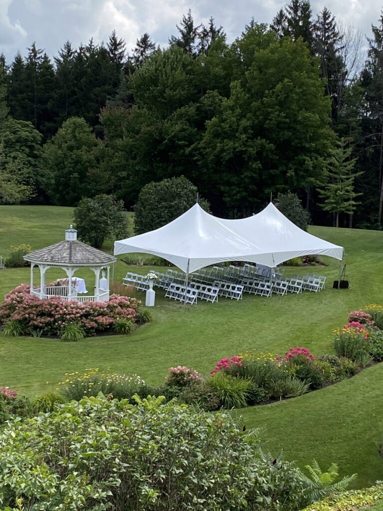 20x40 high peak marquee tent with white resin chairs 2