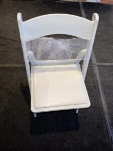 Resin chair with a white bow (Front)